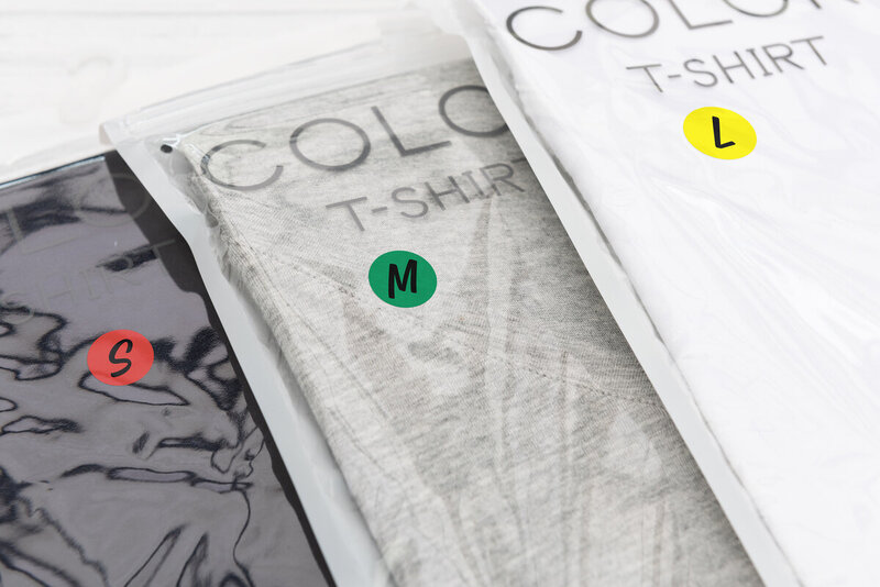 Colour coding labels on t-shirt packages for sizing