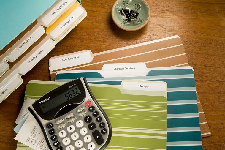 Tax folders with labels on desk