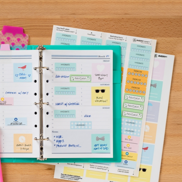 Open binder on a desk showing dividers