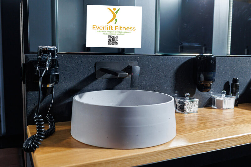 static cling sign on a mirror at a fitness centre