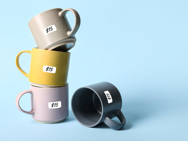 stacked cups with price labels on them